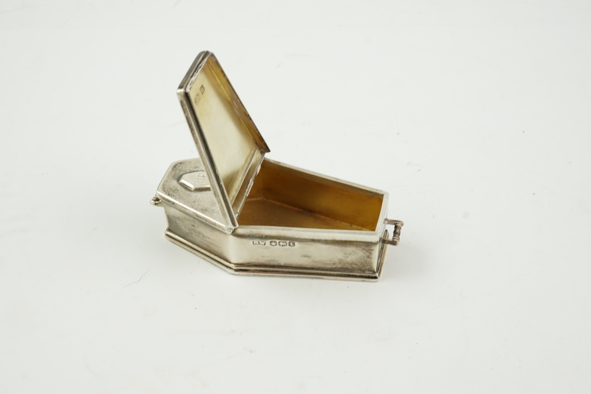 A George VI novelty silver snuff box, modelled as coffin with two handles and an 'RIP' appliqué, maker HW